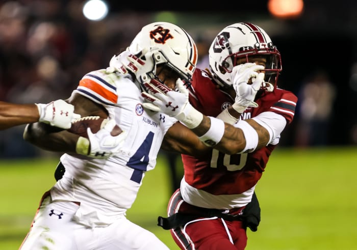 Nov 20, 2021; Columbia, South Carolina, USA; Auburn Tigers running back Tank Bigsby (4) is brought down by South Carolina Gamecocks defensive back R.J. Roderick (10) in the third quarter at Williams-Brice Stadium. Mandatory Credit: Jeff Blake-USA TODAY Sports